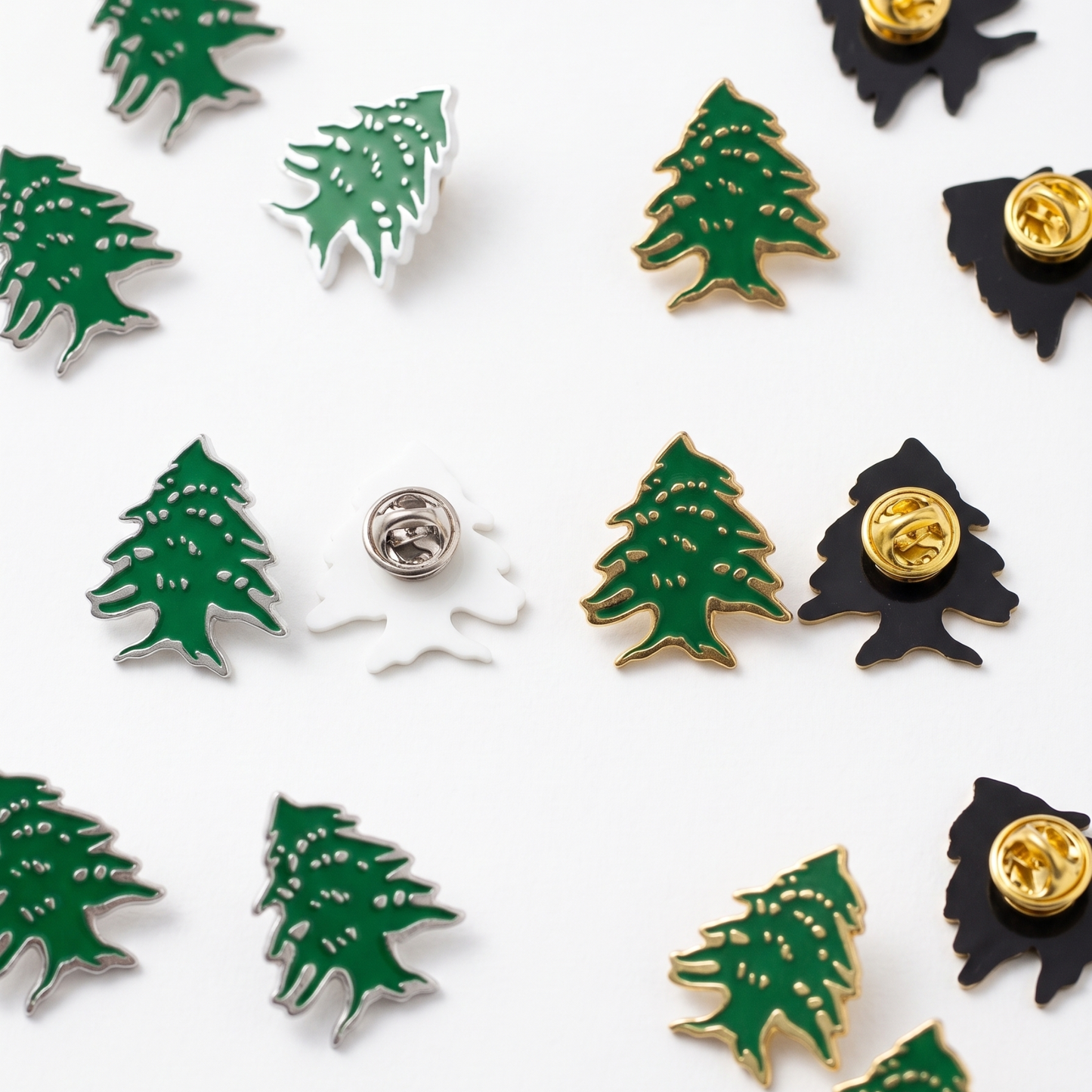 Multiple Lebanese cedar tree lapel pins in green and gold enamel
