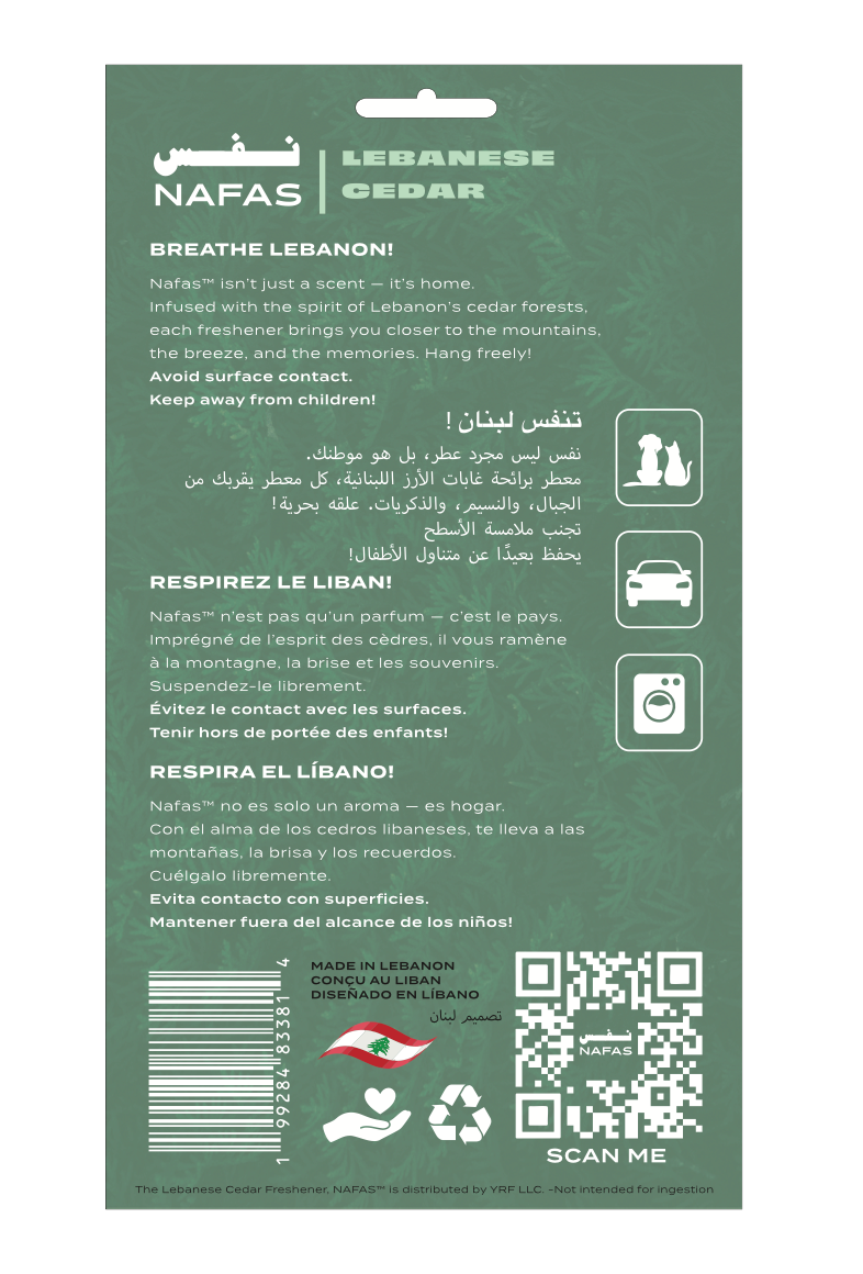 Back packaging of Nafas Lebanese Cedar scented paper air freshener with multilingual instructions, safety icons, barcode, and made in Lebanon label on a green background